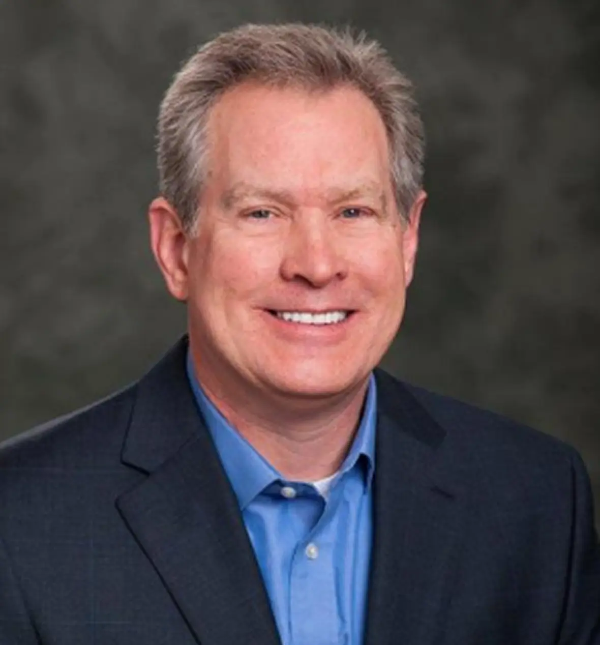 Businessman with gray hair smiling